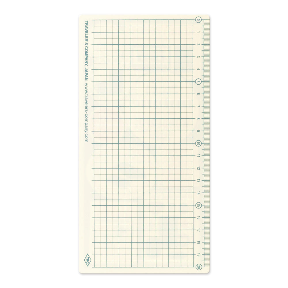 A rectangular grid cutting mat with inch and centimeter measurements, featuring a fine green grid on an off-white background. The brand 'Tablet's Company' is printed vertically along the left edge.