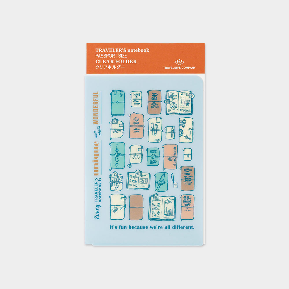 Traveler's notebook clear folder sticker pack by Traveler's Company, featuring a light blue sheet with illustrated travel items and an orange header card, shown on a light gray background.
