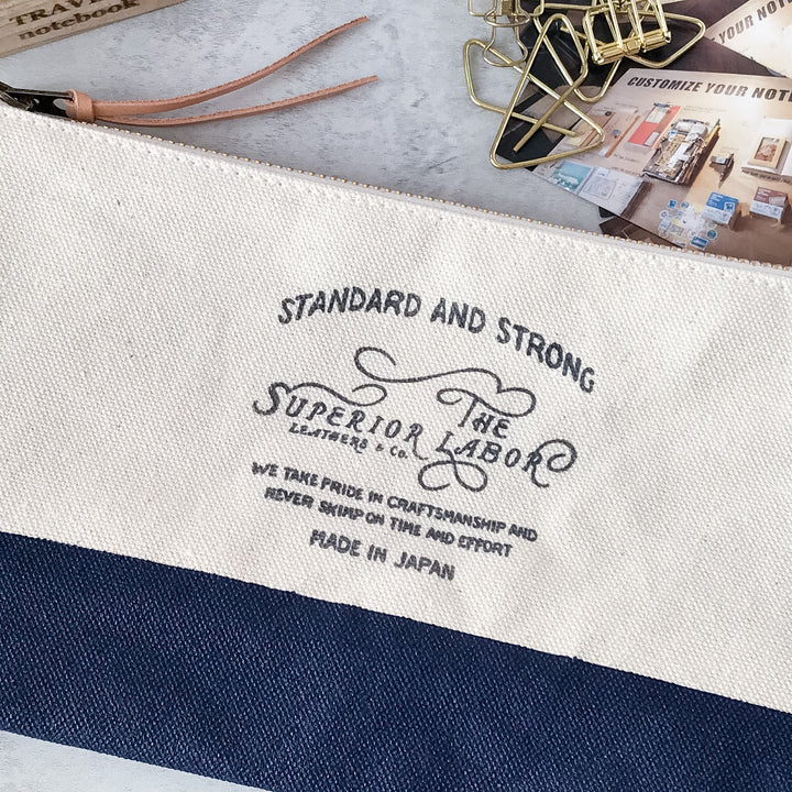Front view of the hand-painted navy leather bottom and stenciled logo on The Superior Labor Engineer Pouch 
