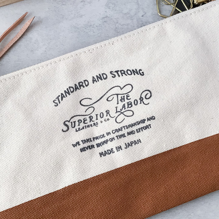 Angled view highlighting the premium No. 8 cotton canvas and hand-painted brown leather base of the Engineer Pouch 
