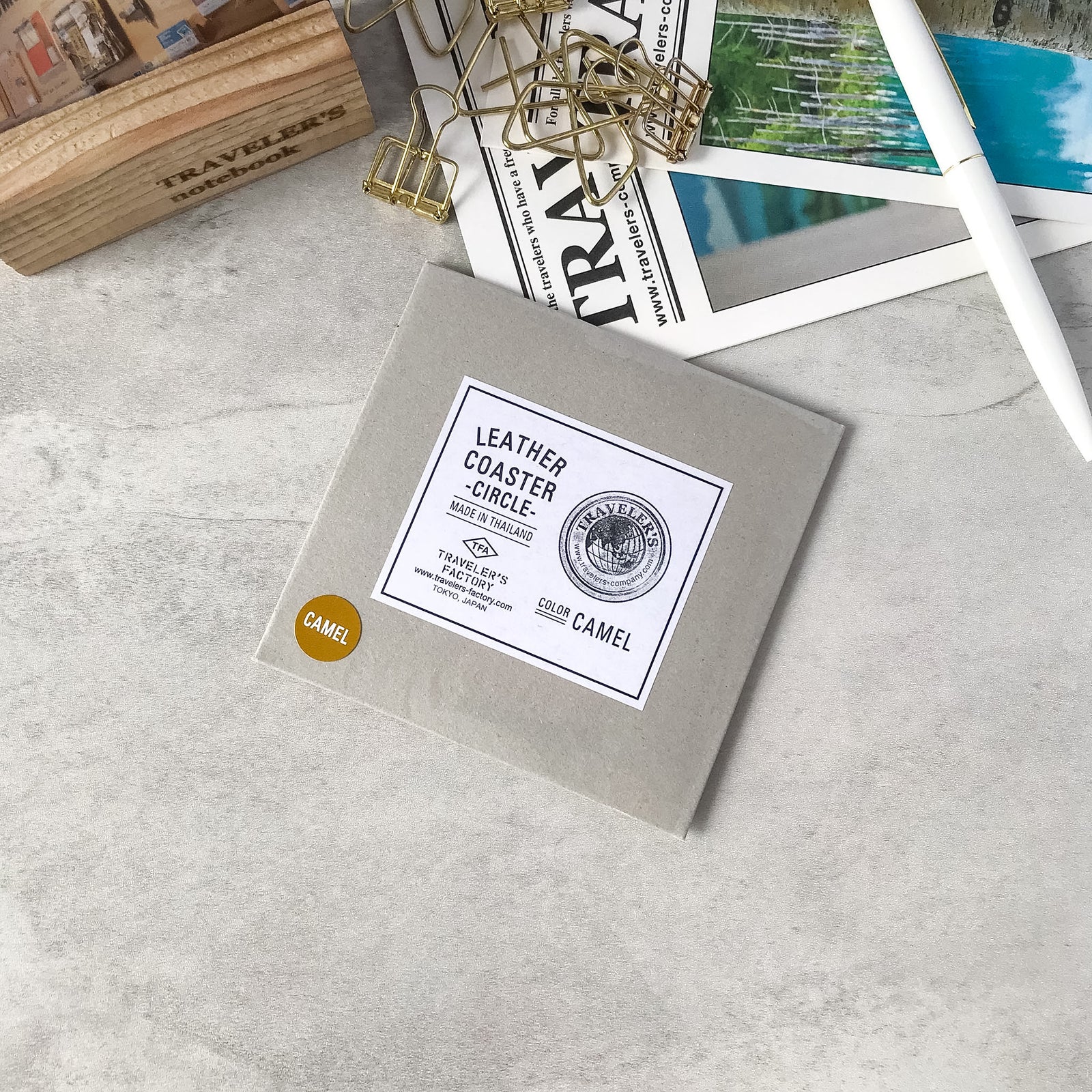 Traveler's Factory Original Leather Coaster Circle Camel in its sealed square paper packaging with official product label.
