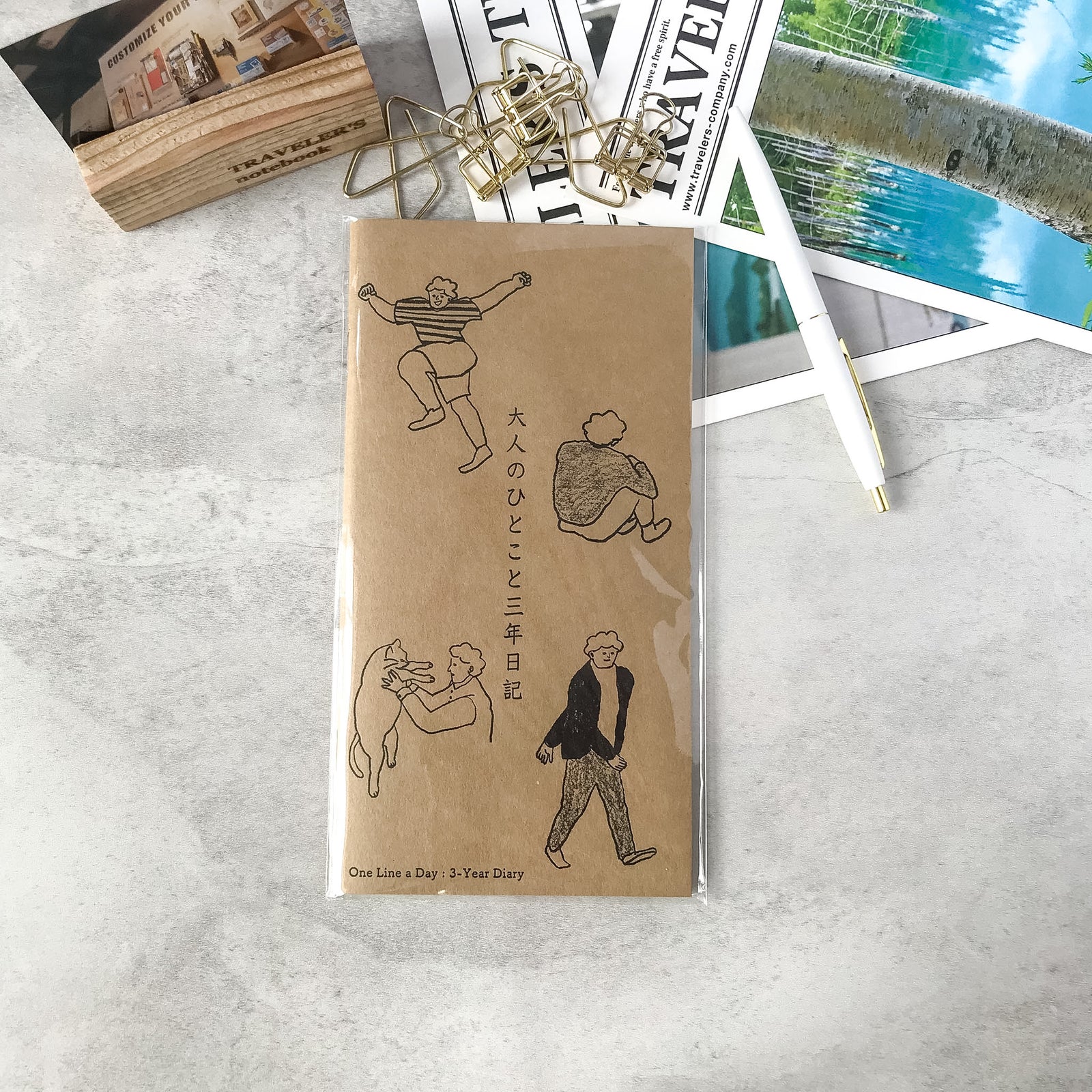 Traveler's Notebook regular refill Mizushima Adult One-Word Three-Year Diary with a letterpress printed illustration cover.