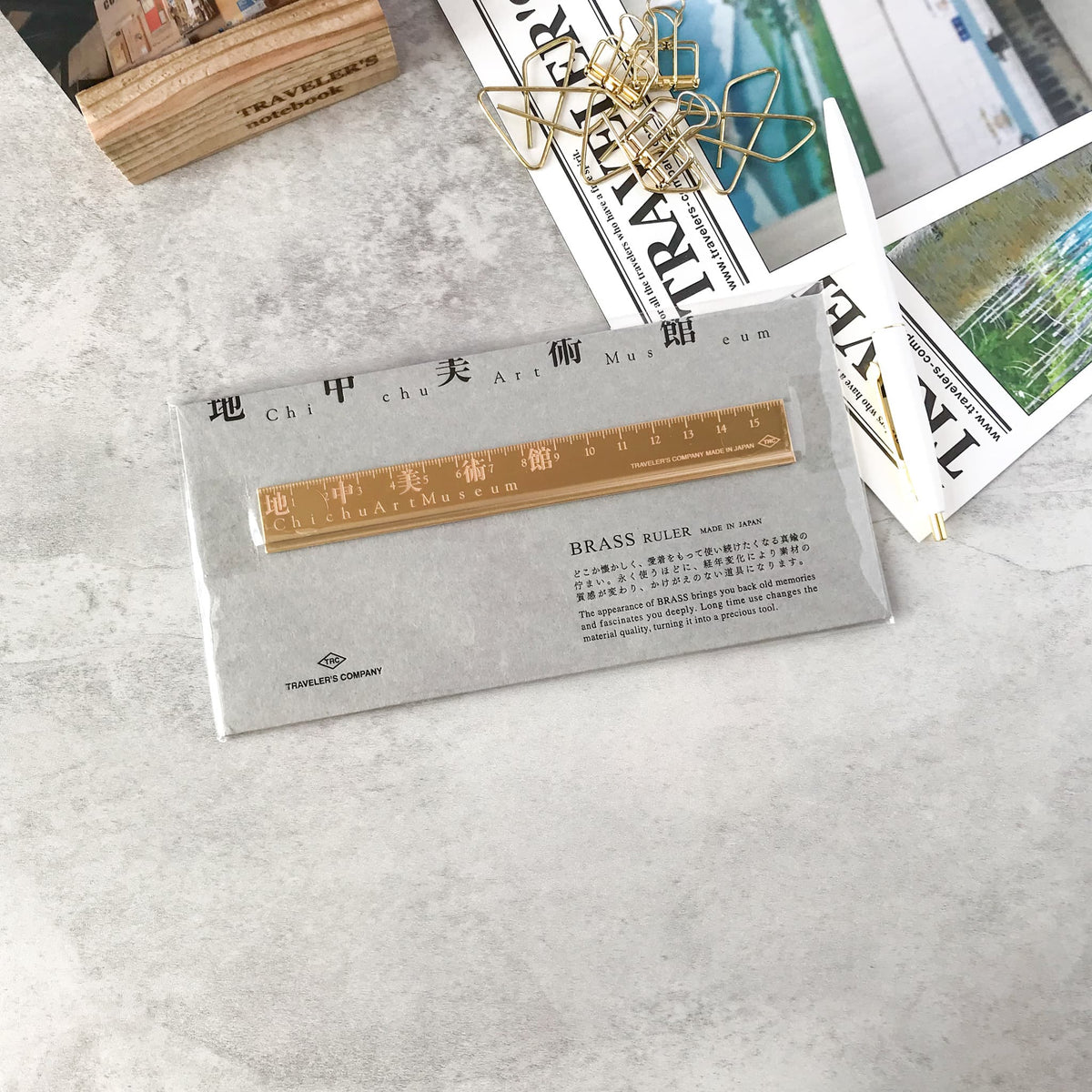 Traveler’s Factory Chichu Art Museum brass ruler in its packaging on a stationery desk