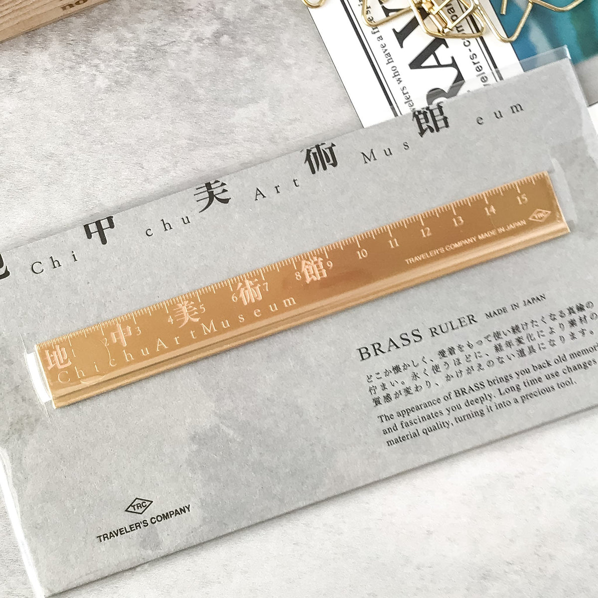 Close-up of the brass ruler inside its packaging