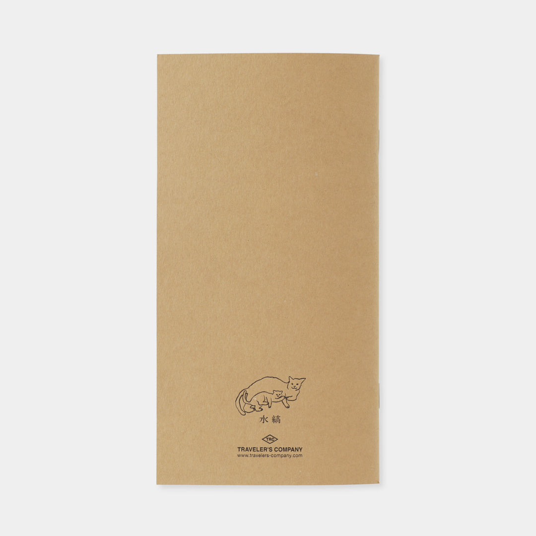 Back view showing the stitched binding and minimalist cream paper design of the Traveler&