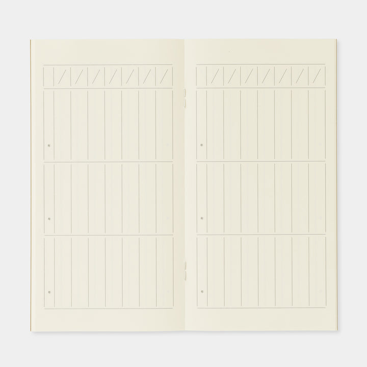 Close-up of the daily entry blocks and grid lines on premium cream Midori MD paper.