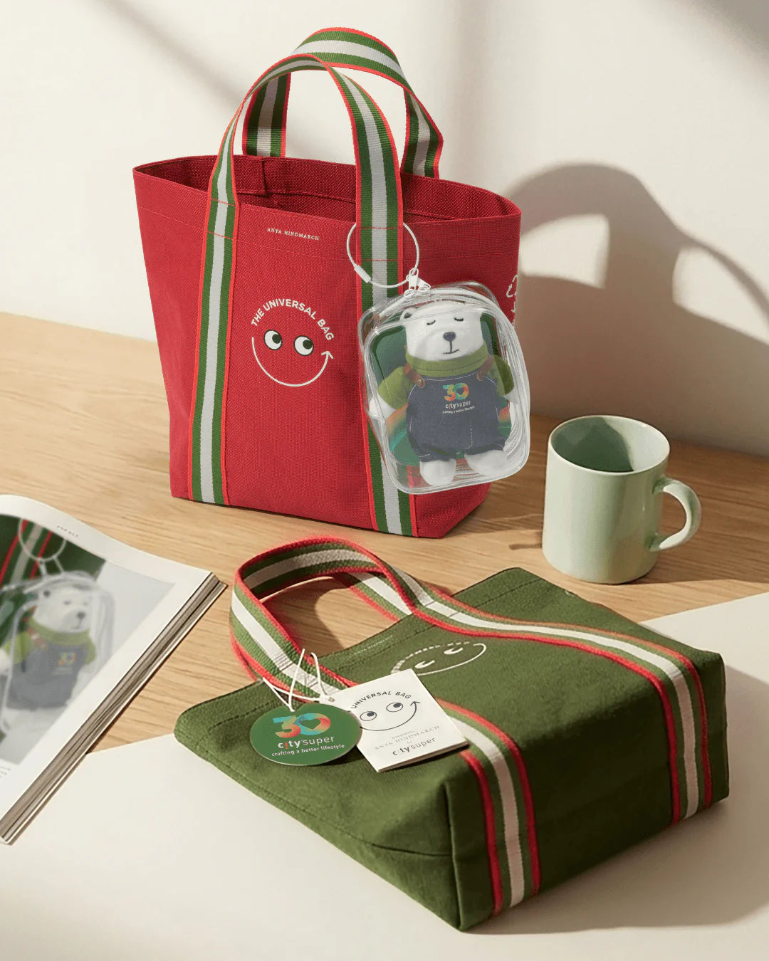 Red and green bags with cartoon character tags on a wooden surface.